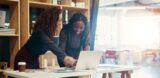 two business owners optimizing their website