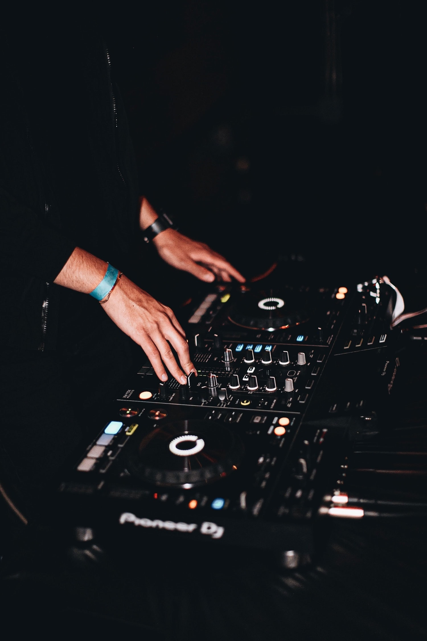 DJ working on his equipment