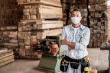 carpenter-working-at-his-workshop-wearing-a-facemask-to-avoid-coronavirus