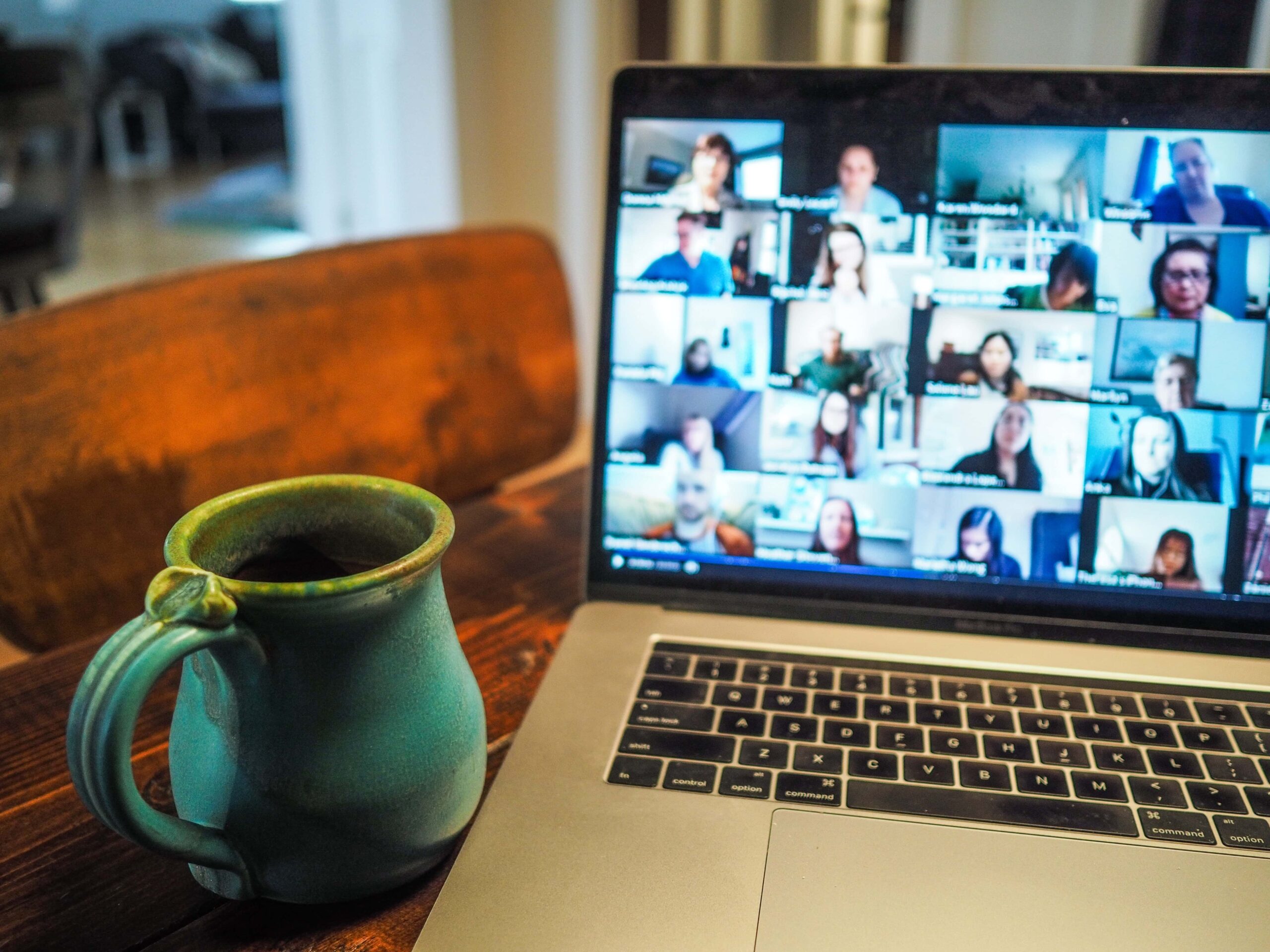 Laptop showing people in an online meeting
