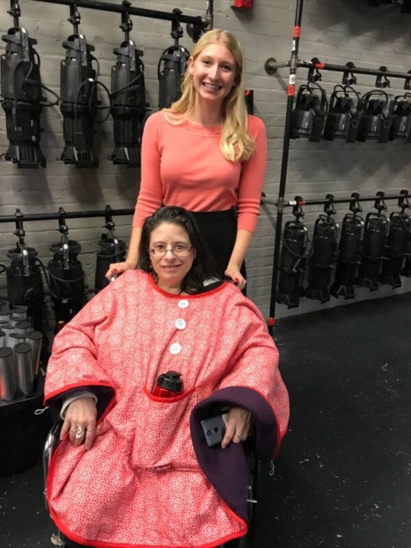 Melanie Barrett and a Bailey Bug client smiling for the camera.
