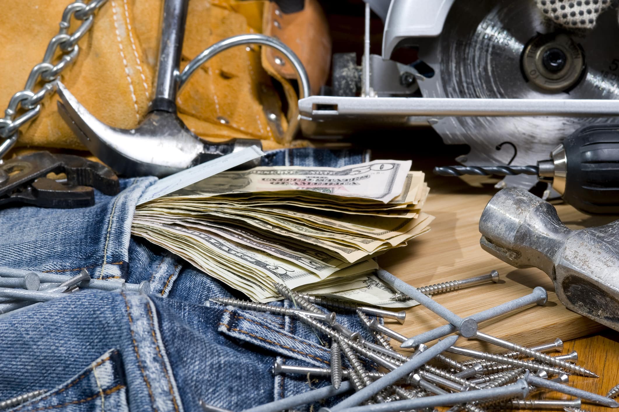 Construction tools with dollar bills