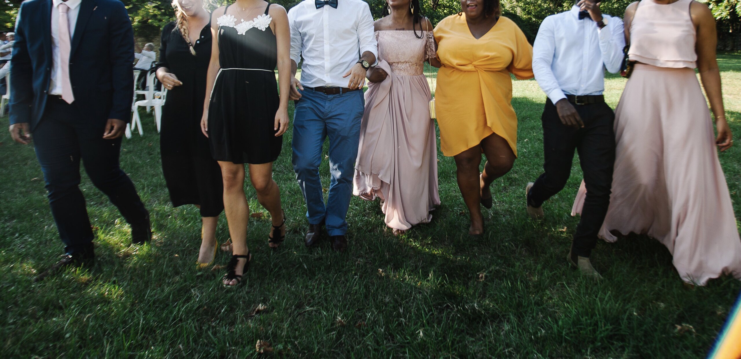 Group celebrating a wedding on a lawn